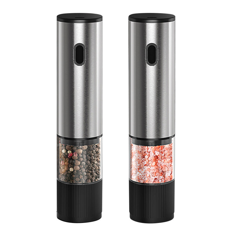 Two stainless steel electric salt and pepper grinders, one with peppercorns and one with pink salt