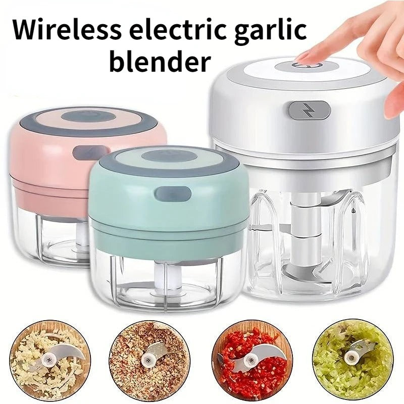 Mini electric garlic chopper in pink, mint green and white with chopped garlic, chilli, ginger and herbs