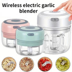Mini electric garlic chopper in pink, mint green and white with chopped garlic, chilli, ginger and herbs